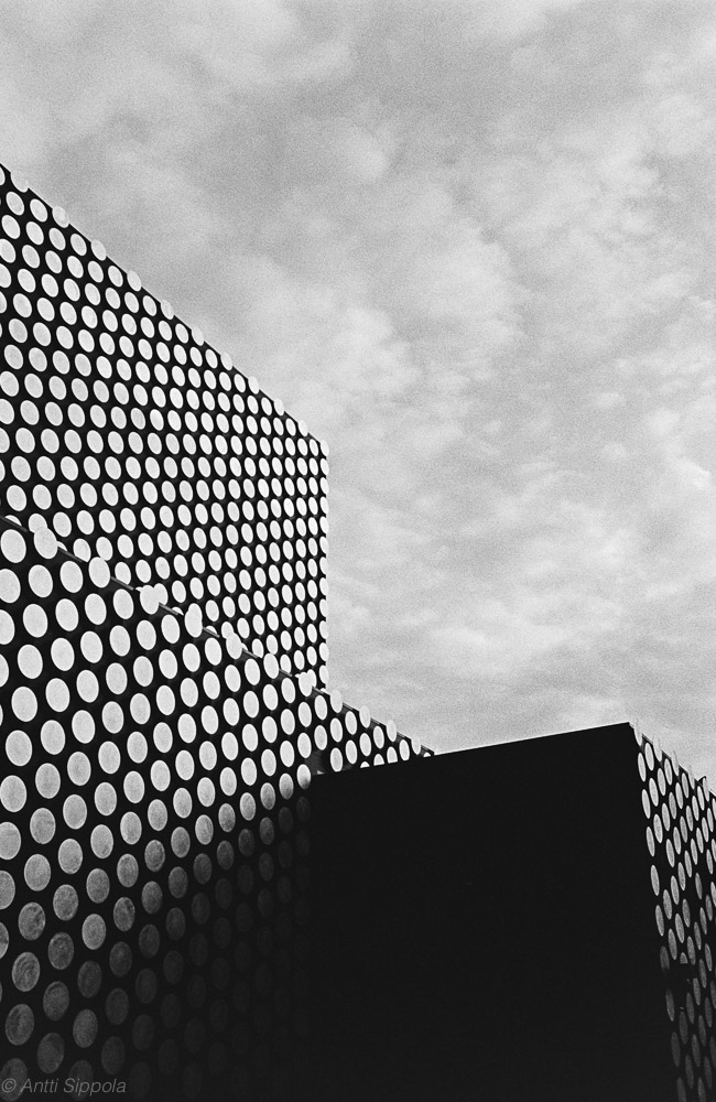 Decorative round plates form a dotted pattern on the outside walls of Dance House Helsinki building.